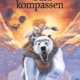 Bokomslag på Guldkompassen visar huvudpersonen Lyra ridande på isbjörn med en guldfärgad bakgrund